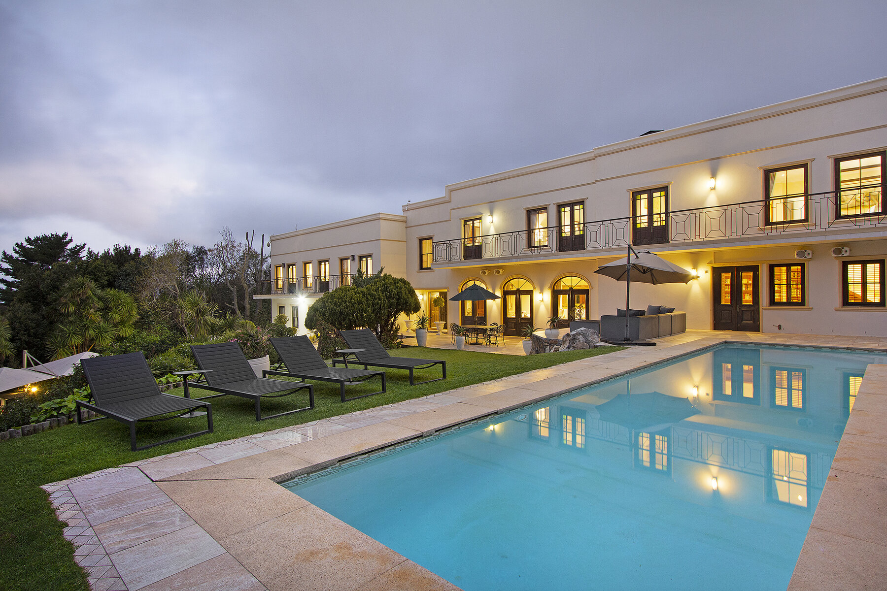 Lyonesse House and its pool at dusk